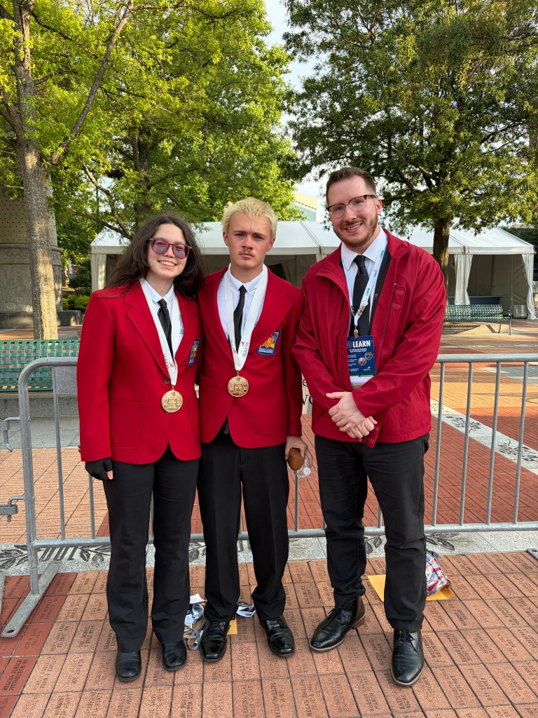 Advisor Cory Nedell with Gold Medal winners!